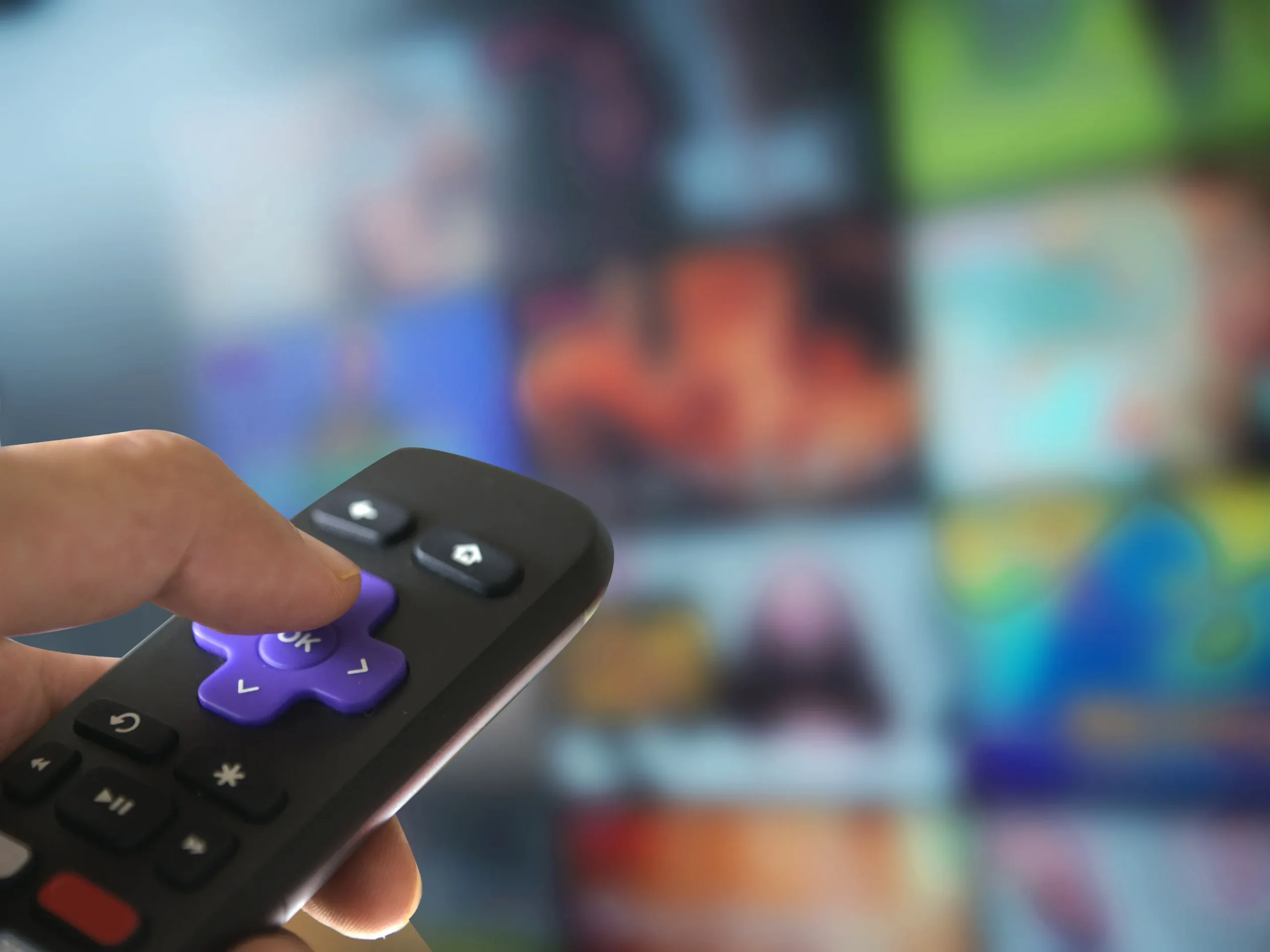 remote going through streaming platforms on television