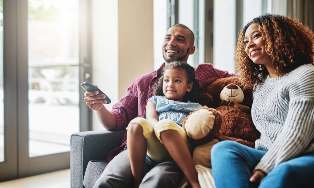 Small business tv advertising in Pittsburgh - family watching a tv advertisement 