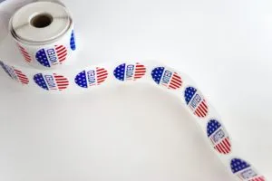 Roll of stickers that say "I Voted" with American flag design