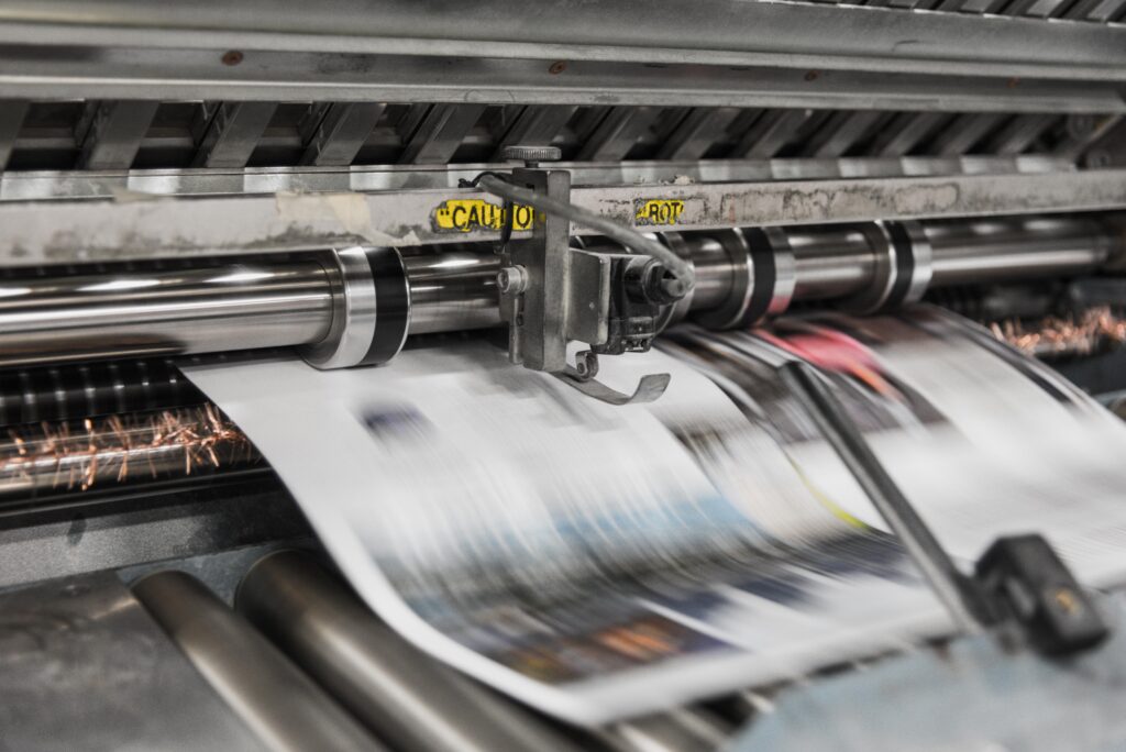 print media being printed from a machine