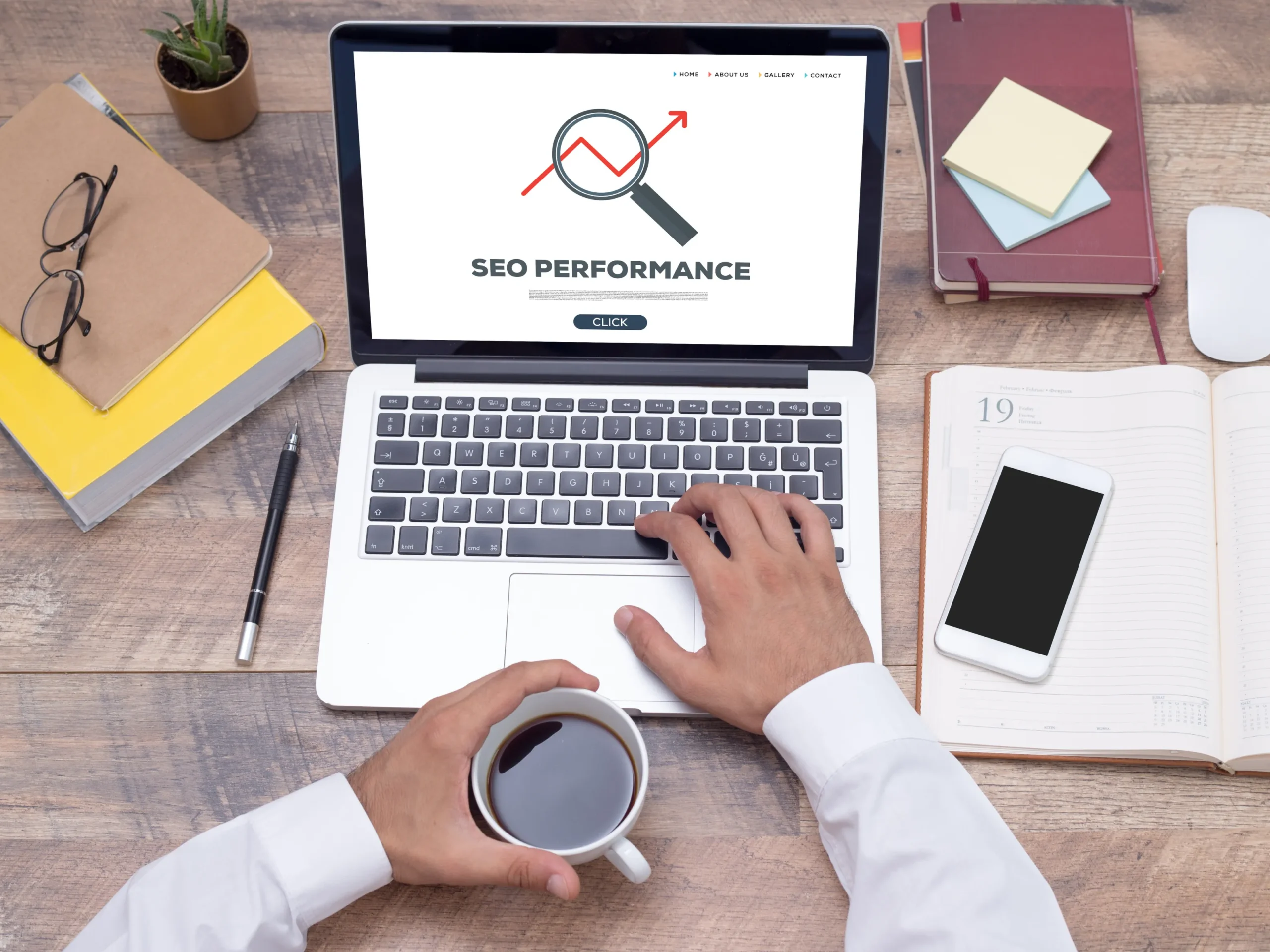 person looking at seo performance on laptop