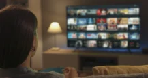 woman relaxing while watching TV